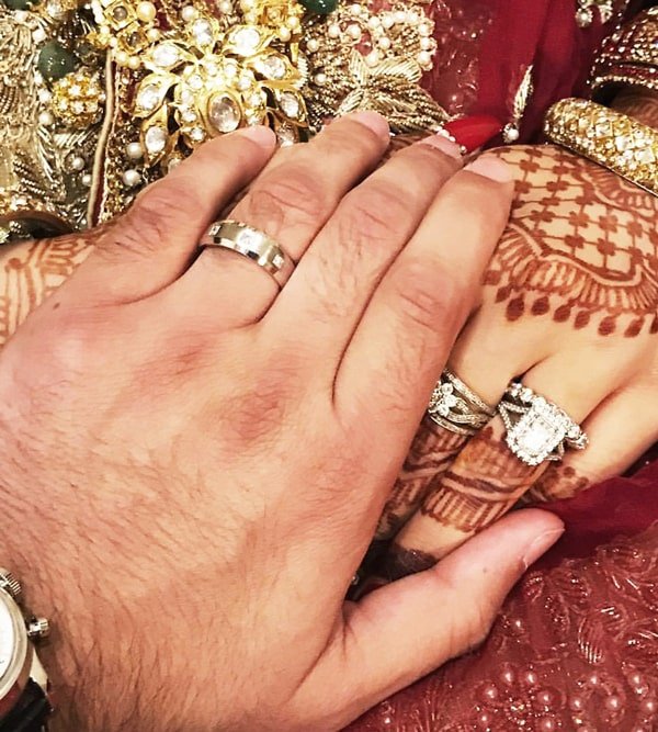 Custom Diamond and Lab Engagement Ring on a couples hand