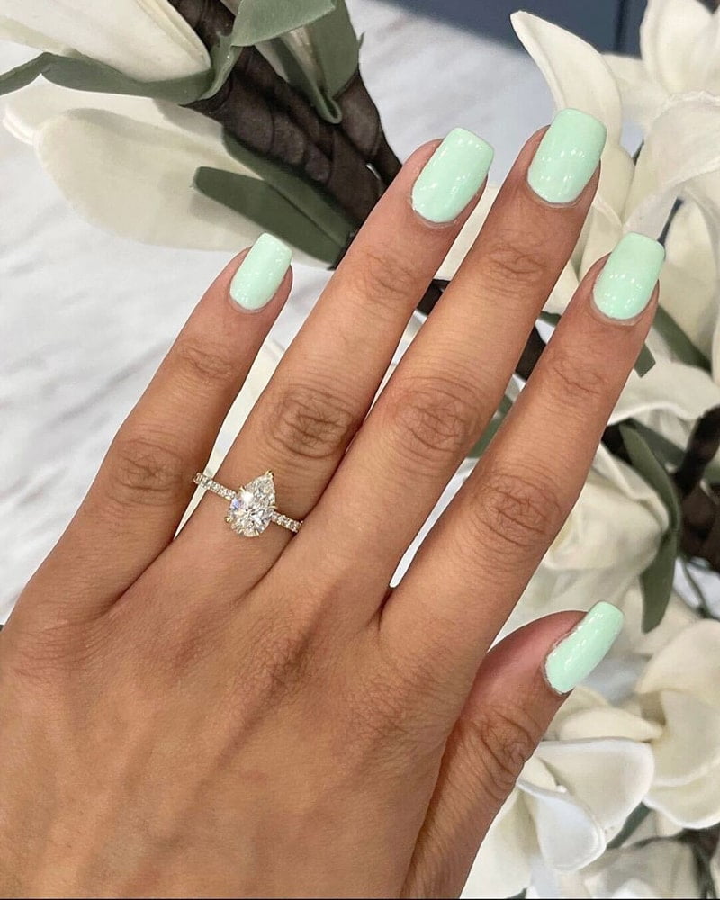 Custom Diamond Engagement Ring on a model's hand